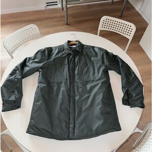 Green jacket with pockets, and button cuffs size medium